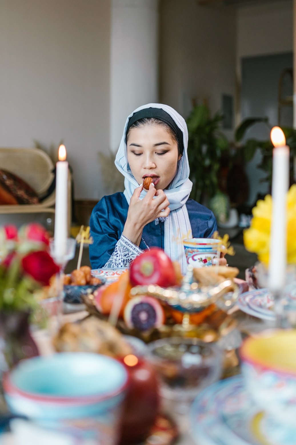 Woman with Hijab Eating 